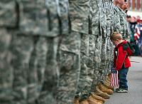 little boy saying goodbye to father being deployed